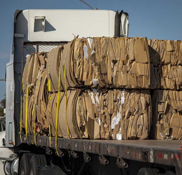 Recyclable cardboard bundled on a truck.